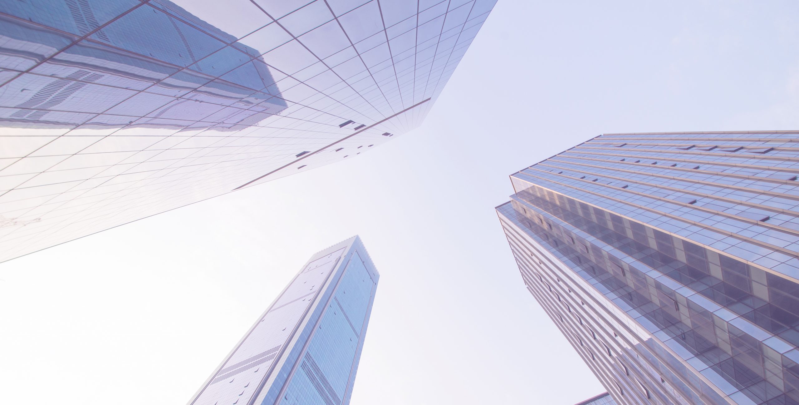 Looking up at business buildings